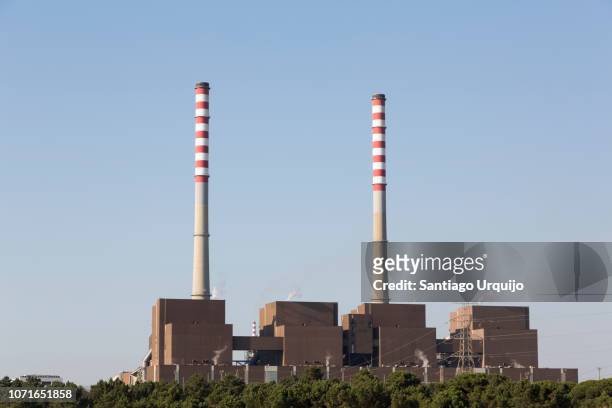 sines thermal power station - chimney stock-fotos und bilder