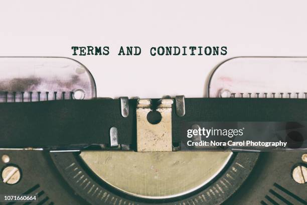 terms and conditions typed on vintage typewriter - employment standards stock pictures, royalty-free photos & images