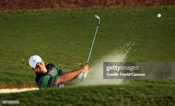 Francesco Molinari of Italy plays his fourth shot at the par 5, 18th hole during the third round of the Dubai World Championship on the Earth Course...