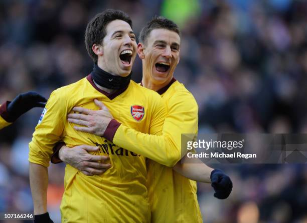 Samir Nasri of Arsenal celebrates scoring to make it 2-0 with team mate Laurent Koscielny during the Barclays Premier League match between Aston...