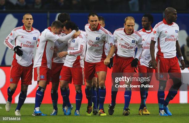 Piotr Trochowski of Hamburg celebrates with his team mates after scoring his team's first goal during the Bundesliga match between Hamburger SV and...