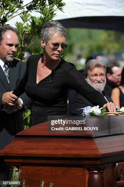 Actress Jamie Lee Curtis places a flower on the casket of her father Hollywood legend Tony Curtis at the Palm Mortuary and Cemetery, Green Valley in...
