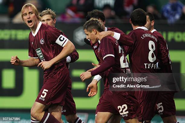 Martin Amedick celebrates his team's second goal with team mates during the Bundesliga match between 1. FC Kaiserslautern and FC Schalke 04 at...