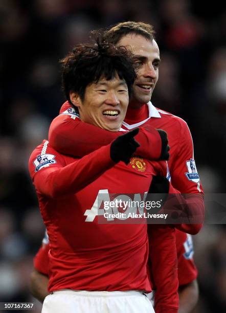 Ji-Sung Park of Manchester United celebrates scoring his team's second goal with team mate Dimitar Berbatov during the Barclays Premier League match...