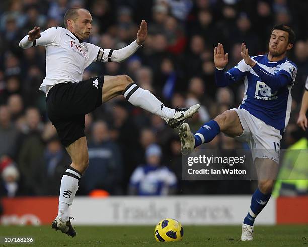 Danny Murphy of Fulham tries to tackle Barry Ferguson of Birmingham City during the Barclays Premier League match between Fulham and Birmingham City...