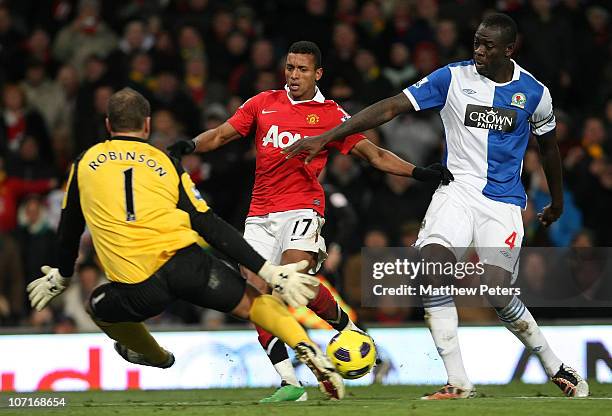 Nani of Manchester United clashes with Paul Robinson and Christopher Samba of Blackburn Rovers during the Barclays Premier League match between...