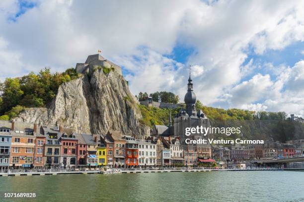 city view of dinant from the riverside of the meuse, belgium - provincie namur stockfoto's en -beelden
