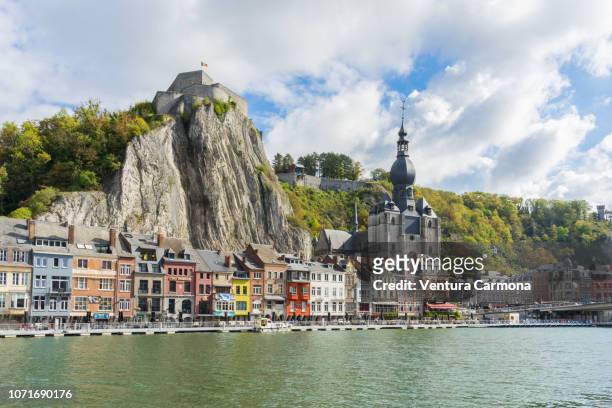 city view of dinant from the riverside of the meuse, belgium - namur stock pictures, royalty-free photos & images