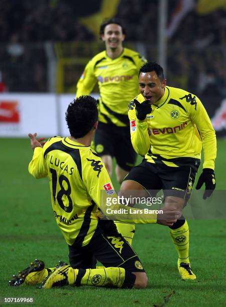 Lucas Barrios of Dortmund celebrates with team mate Antonio da Silva after scoring his teams fourth goal during the Bundesliga match between Borussia...