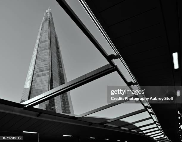 shard as seen from london bridge train station. - monochrome scene stock pictures, royalty-free photos & images