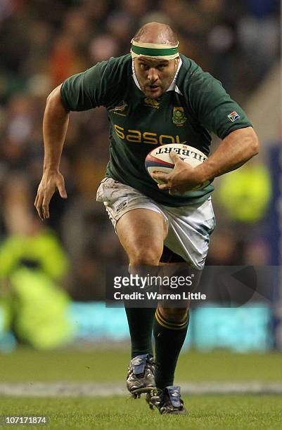 Van der Linde of South Africa runs with the ball during the Investec Challenge match between England and South Africa at Twickenham Stadium on...