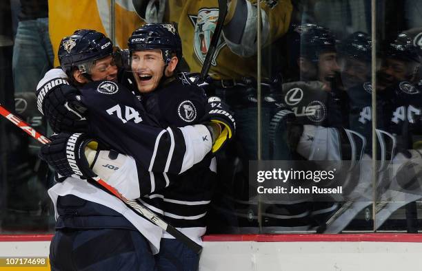 Colin Wilson and Sergei Kostitsyn of the Nashville Predators celebrate a goal against the New York Rangers during an NHL game on November 27, 2010 at...