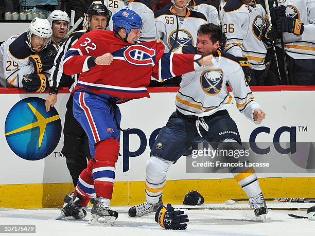 Travis Moen of the Montreal Canadiens and Cody McCormick of the Buffalo Sabres exchange punches during the NHL game on November 27, 2010 at the Bell...