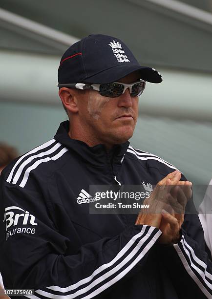 England coach Andy Flower looks on after having an operation to remove a skin cancer near his right eye during day four of the First Ashes Test match...