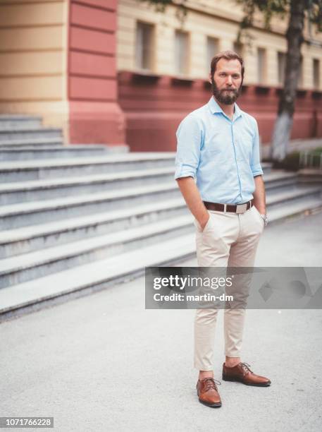 school principal standing in front of the school building - teacher standing stock pictures, royalty-free photos & images