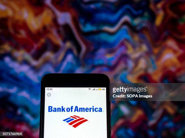 In this photo illustration, the Bank of America Investment banking company logo seen displayed on a smartphone.