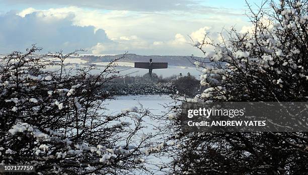The landmark sculpture entitled 'Angel of the North' by British artist Antony Gormley stands amongst snow near Gateshead, in north-east England, on...