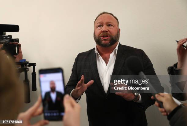 Alex Jones, radio host and creator of the website InfoWars, speaks to members of the media before a House Judiciary Committee hearing with Sundar...