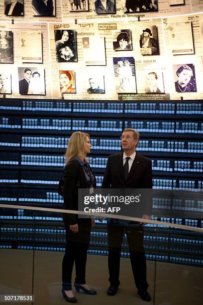German President Christian Wulff and his daughter Annalena stand in the Hall of Names during a visit to the Yad Vashem Holocaust memorial, in...