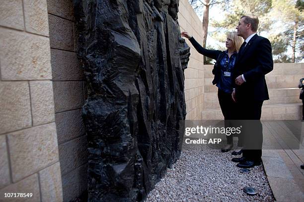 German President Christian Wulff and his daughter Annalena stand in the Janusz Korczak Square at the Yad Vashem Holocaust memorial, in Jerusalem, on...
