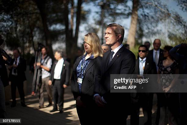 German President Christian Wulff stands along side his daughter Annalena at the Janusz Korczak Square, during a visit at the Yad Vashem Holocaust...