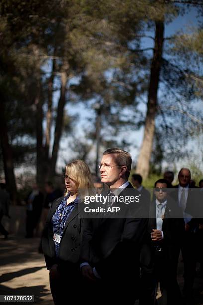 German President Christian Wulff stands along side his daughter Annalena at the Janusz Korczak Square, during a visit at the Yad Vashem Holocaust...