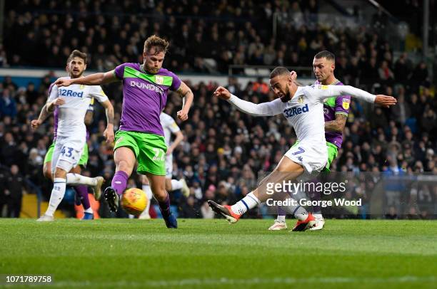 Kemar Roofe of Leeds United shoots at goal under pressure from Tomas Kalas of Bristol City during the Sky Bet Championship match between Leeds United...