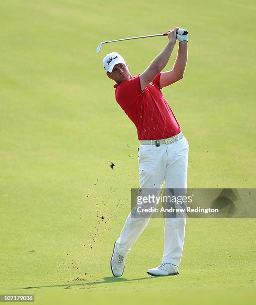 Robert Karlsson of Sweden hits his second shot on the 12th hole during the final round of the Dubai World Championship on the Earth Course, Jumeirah...