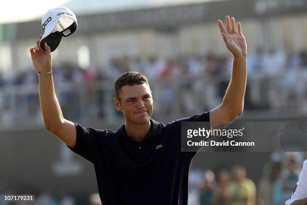 Martin Kaymer of Germany celebrates securing the Race to Dubai Trophy on the 18th green during the final round of the Dubai World Championship on the...