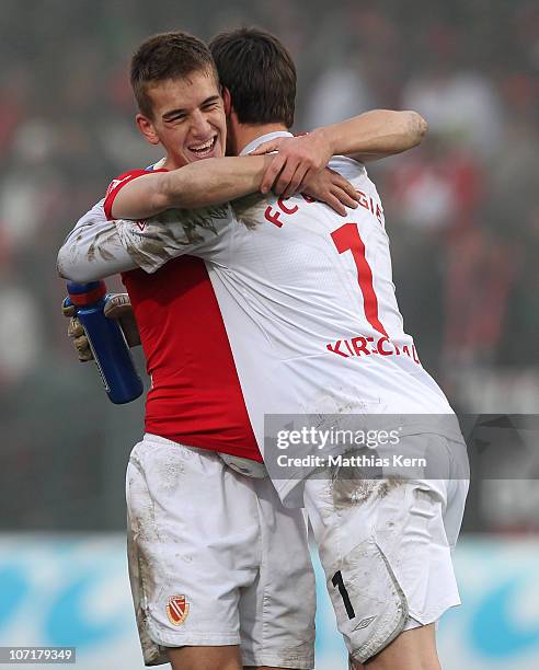 Uwe Huenemeier of Cottbus and team mate Thorsten Kirschbaum show their delight aftre winning the Second Bundesliga match between FC Energie Cottbus...