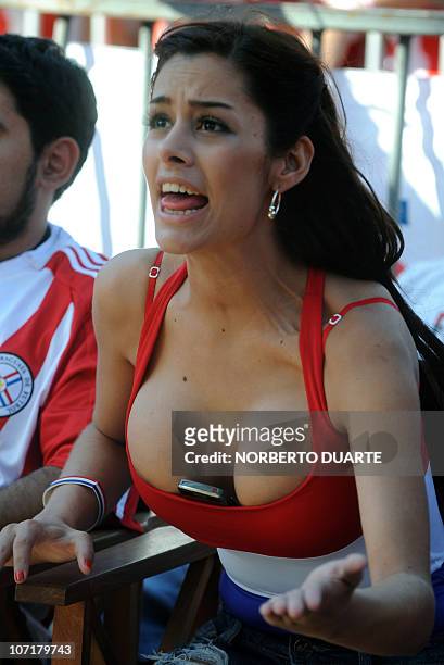 Paraguayan model Larissa Riquelme gestures as she watches on a huge screen the FIFA World Cup 2010 match against New Zealand, in downtown Asuncion,...