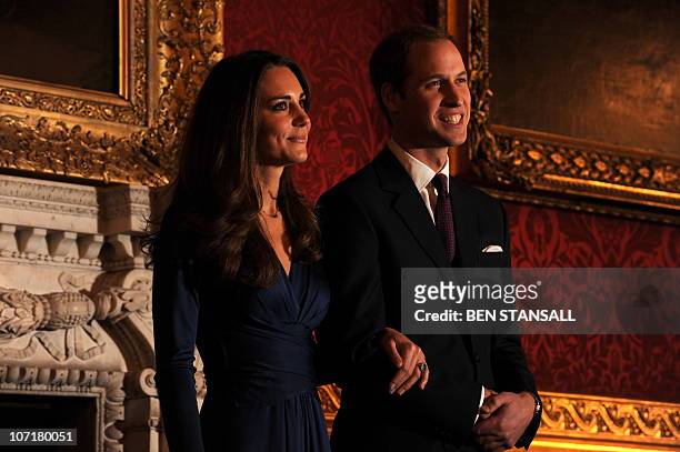 Britain's Prince William and his fiancée Kate Middleton pose for photographers during a photocall to mark their engagement, in the State Rooms of St...