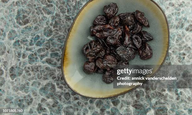 dried plums - dried plum stock pictures, royalty-free photos & images