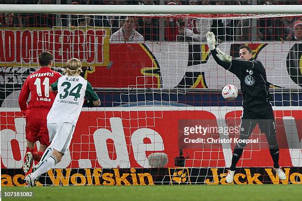 Diego Benaglio of Wolfsburg drops the ball against Milivoje Novakovic of Koeln (Patrick Helmes of Leverkusen who scores the fiorst goal during the...