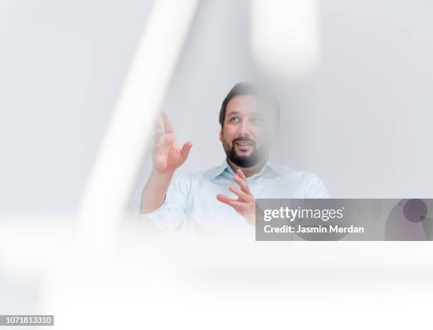 businessman talking in office - indicating stock-fotos und bilder