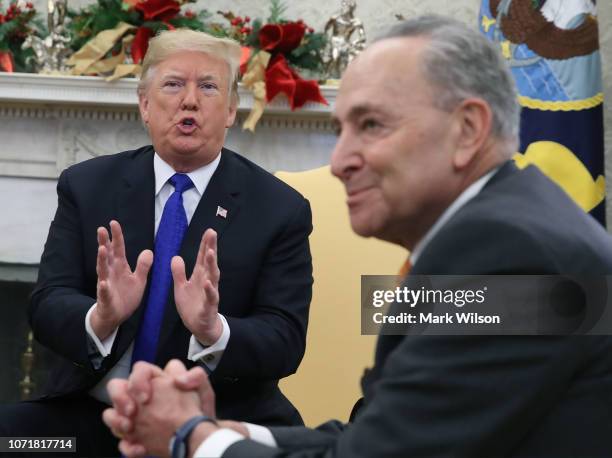 President Donald Trump argues about border security with Senate Minority Leader Chuck Schumer in the Oval Office on December 11, 2018 in Washington,...