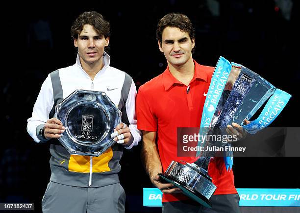 Roger Federer of Switzerland poses with the winners trophy and Rafael Nadal of Spain after their men's final match during the ATP World Tour Finals...