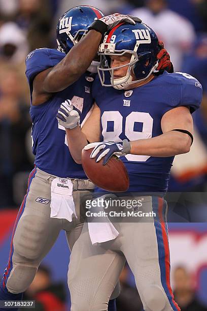 Kevin Boss of the New York Giants celebrates scoring the winning touchdown with team mate Ahmad Bradshaw against the Jacksonville Jaguars at New...
