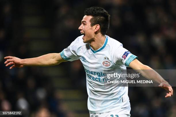 Eindhoven's Mexican forward Hirving Lozano celebrates after opening the scoring during the UEFA Champions League group B football match Inter Milan...