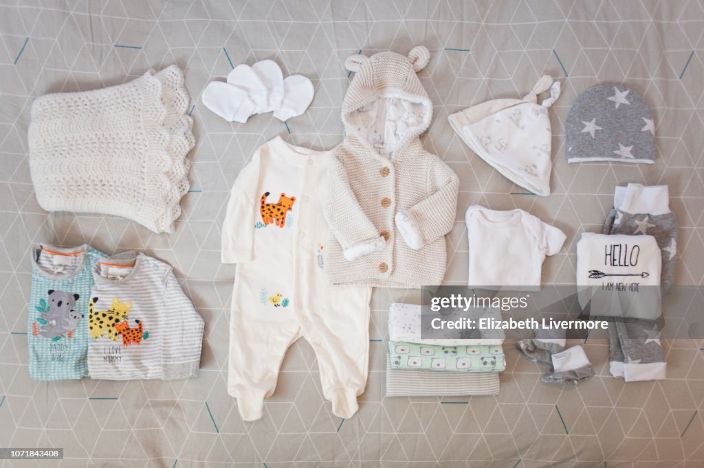 Flat lay of newborn baby clothing