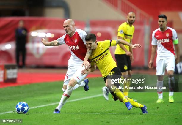 Andrea Raggi of Monaco holds off Christian Pulisic of Borussia Dortmund during the UEFA Champions League Group A match between AS Monaco and Borussia...