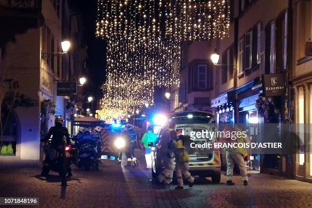 Rescuers walk in the streets of Strasbourg, eastern France, after a shooting breakout, on December 11, 2018. At least two people have been killed and...