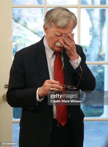 National Security Adviser John Bolton attends a meeting in the Oval Office where U.S. President Donald Trump signed H.R. 390, the "Iraq and Syria...