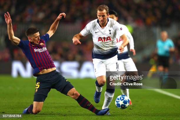 Harry Kane of Tottenham Hotspur is tackled by Clement Lenglet of Barcelona during the UEFA Champions League Group B match between FC Barcelona and...