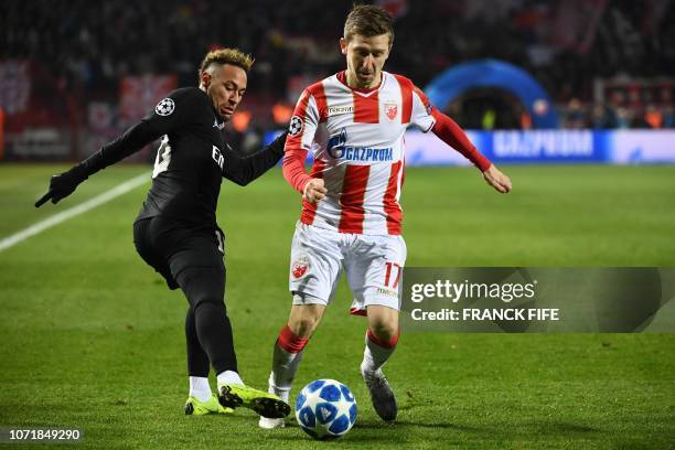 Paris Saint-Germain's Brazilian forward Neymar vies with Red Star Belgrade's German midfielder Marko Marin during the European Champions League...