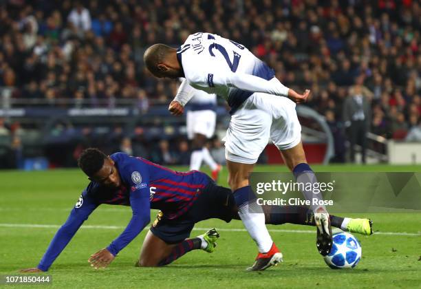 Lucas Moura of Tottenham Hotspur is challenged by Nelson Semedo of Barcelona in the penalty area during the UEFA Champions League Group B match...