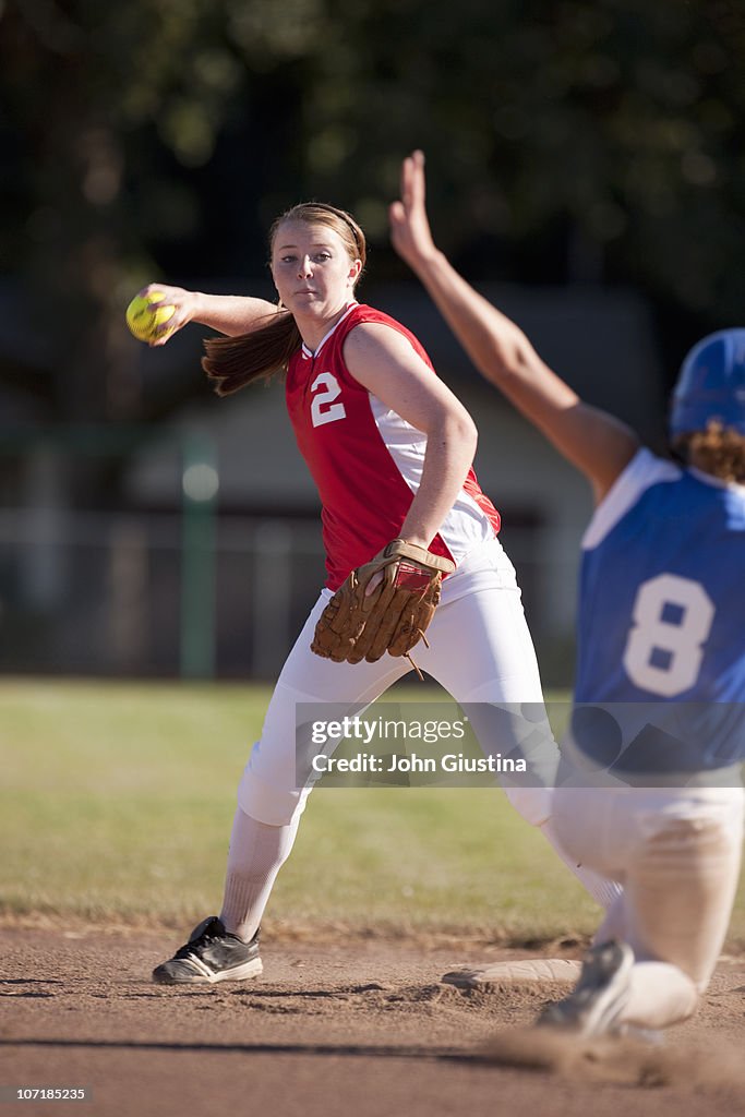 Girl softball player making a throw.