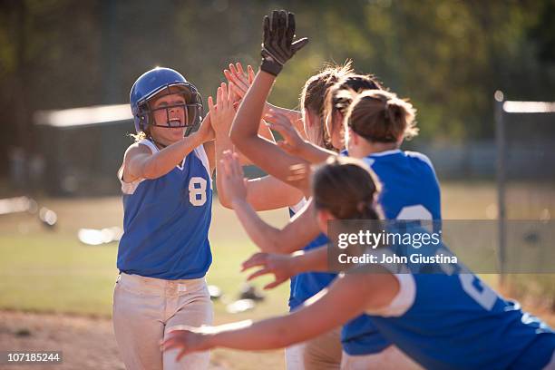 softball players celebrate. - softball sport stock pictures, royalty-free photos & images