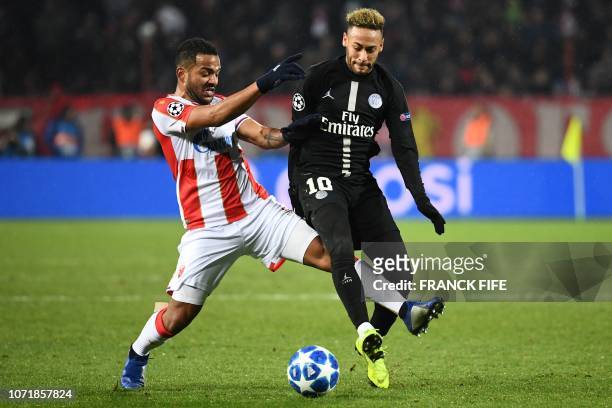 Red Star Belgrade's Dutch midfielder Lorenzo Ebicilio vies with Paris Saint-Germain's Brazilian forward Neymar during the European Champions League...