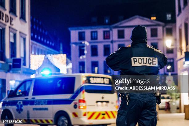 Police and emergency services intervene on Place Gutenberg after a shooting on December 11, 2018 in Strasbourg, eastern France. The suspect who...